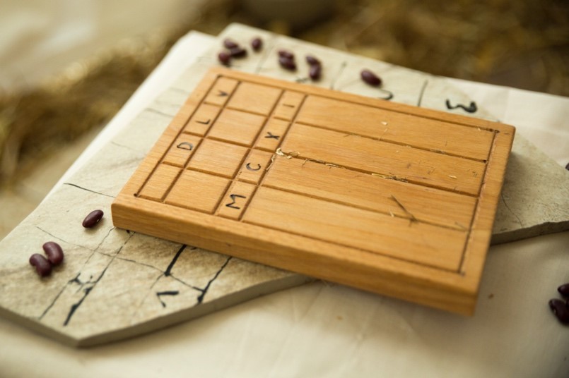 Counting boards and beans (photo by Alex Wickenden)